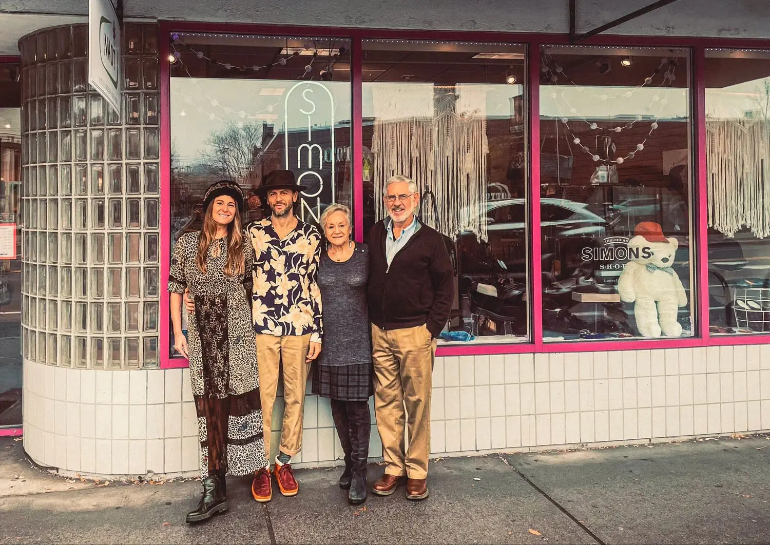 The Simons family in front of the Simons Shoes storefront today